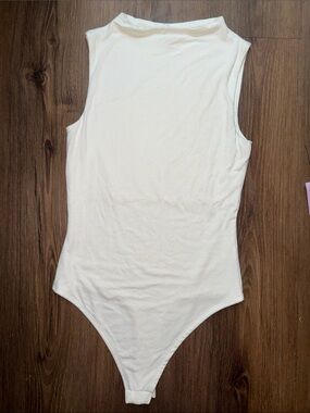 Sleeveless Cream Ribbed Bodysuit - Classic Fit